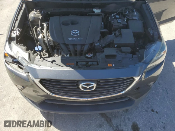 2017 Mazda CX-3 Touring z VIN JM1DKDC73H0172403, wystawiony jako Copart lot #47396355 z przebiegiem 79 865 mil mil oraz Szkoda całkowita • Salvage title. Historia ofert i sprzedaży dostępna na DreamBid. Obrazek 12.