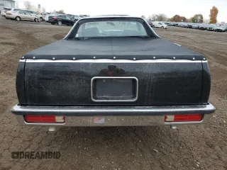 1986 GMC Caballero z VIN 3GTCW80Z1GS801760, wystawiony jako Copart lot #77592504 z przebiegiem 64 797 mil mil oraz Tytuł czysty. Historia ofert i sprzedaży dostępna na DreamBid. Obrazek 6.