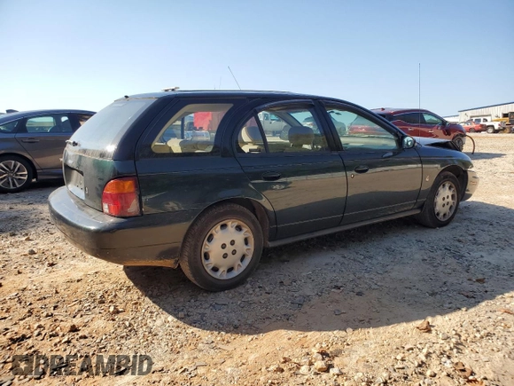 1997 Saturn SW z VIN 1G8ZK8278VZ379899, wystawiony jako Copart lot #74913664 z przebiegiem 126 186 mil mil oraz Szkoda całkowita • Salvage title. Historia ofert i sprzedaży dostępna na DreamBid. Obrazek 3.