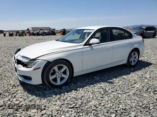 2014 BMW 3 Series 320i with VIN WBA3B1C55EK133687, listed as a Copart auction lot 63049945 with 95,604 mi miles and Salvage title. Bid and sale history available at DreamBid. Image 1.