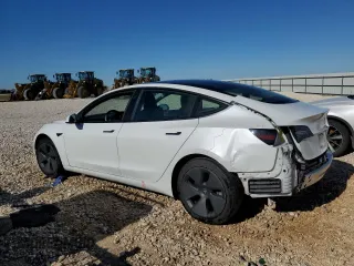 2021 Tesla Model 3 Standard Range Plus with VIN 5YJ3E1EA7MF089997, listed as a Copart auction lot 81528284 with 147,242 mi miles and Clean Title. Bid and sale history available at DreamBid. Image 2.