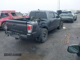 2022 Toyota Tacoma SR with VIN 3TMCZ5AN1NM476353, listed as a IAAI auction lot 41938107 with 51,782 mi miles and . Bid and sale history available at DreamBid. Image 4.