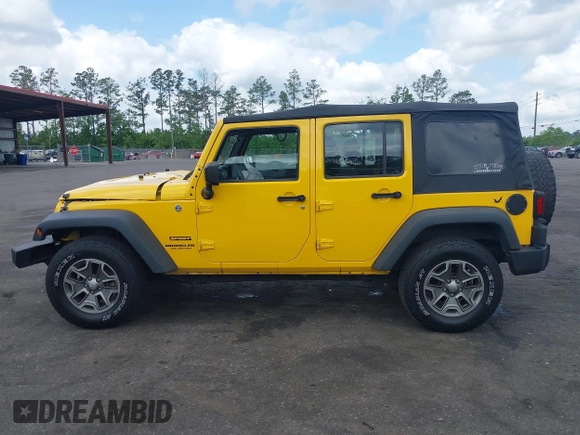 2015 Jeep Wrangler Unlimited Willys Wheeler with VIN 1C4BJWDG2FL643375, listed as a IAAI auction lot 42109724 with 112,357 mi miles and . Bid and sale history available at DreamBid. Image 14.
