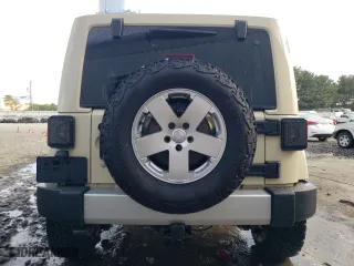 2011 Jeep Wrangler Unlimited Sahara with VIN 1J4BA5H19BL593658, listed as a Copart auction lot 71947684 with 122,323 mi miles and Salvage Title. Bid and sale history available at carsss.com. Image 6.
