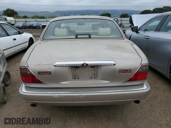 1997 Jaguar XJ Vanden Plas with VIN SAJKX6245VC800386, listed as a Copart auction lot 53651675 with 158,185 mi miles and Salvage Title. Bid and sale history available at DreamBid. Image 6.