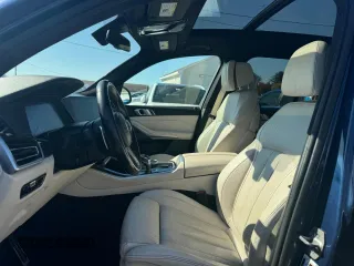 2021 BMW X5 M50i with VIN 5UXJU4C00M9H36466, listed as a Copart auction lot 77444344 with 100,119 mi miles and Clean Title. Bid and sale history available at carsss.com. Image 9.