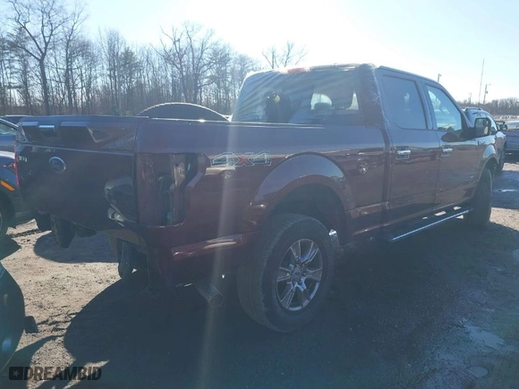 2015 Ford F-150 XLT w/HD Payload Pkg with VIN 1FTFW1EG9FFC44739, listed as a IAAI auction lot 41193582 with 121,169 mi miles. Bid and sale history available at carsss.com. Image 4.