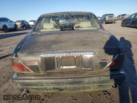1995 Jaguar XJ with VIN SAJKX1747SC722815, listed as a Copart auction lot 83743934 with Not Provided miles and Clean Title. Bid and sale history available at DreamBid. Image 6.