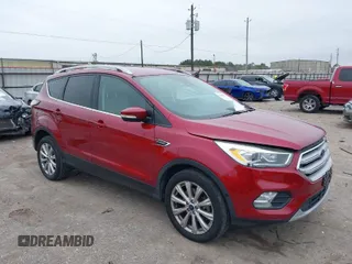 2017 Ford Escape Titanium with VIN 1FMCU9JD5HUC13663, listed as a IAAI auction lot 41636511 with 103,063 mi miles. Bid and sale history available at carsss.com. Image 1.