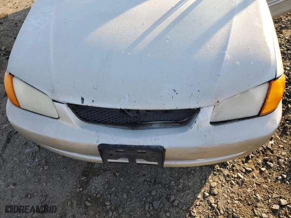 2000 Mazda Protege DX with VIN JM1BJ2225Y0240057, listed as a Copart auction lot 88787865 with 0 mi miles and Salvage Title. Bid and sale history available at carsss.com. Image 12.