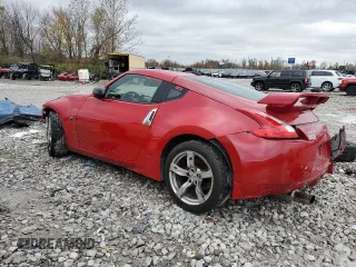 2009 Nissan 370Z z VIN JN1AZ44E19M400603, wystawiony jako Copart lot #79878474 z przebiegiem 129 976 mil mil oraz Szkoda całkowita • Salvage title. Historia ofert i sprzedaży dostępna na DreamBid. Obrazek 2.