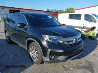 2021 Honda Pilot EX-L with VIN 5FNYF5H55MB044677, listed as a IAAI auction lot 42038704 with 38,684 mi miles and . Bid and sale history available at carsss.com. Image 12.