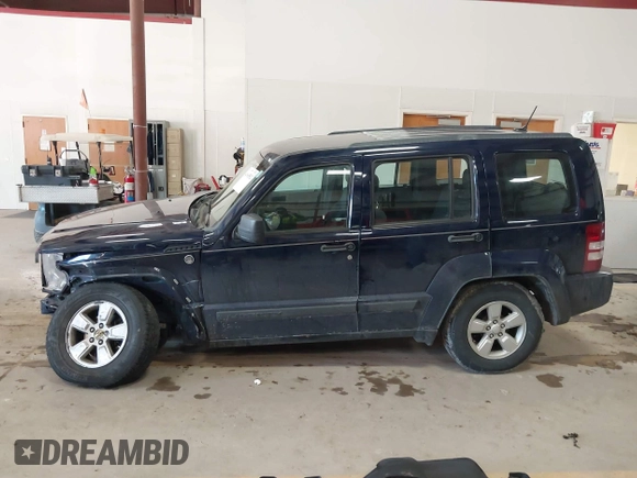 2012 Jeep Liberty Sport z VIN 1C4PJMAK9CW158308, wystawiony jako IAAI lot #41665502 z przebiegiem 125 595 mil mil oraz . Historia ofert i sprzedaży dostępna na DreamBid. Obrazek 14.