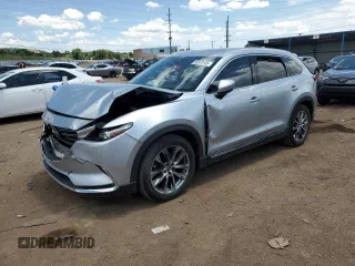 2016 Mazda CX-9 Grand Touring with VIN JM3TCADY2G0121026, listed as a Copart auction lot 60518105 with 104,923 mi miles and Salvage title. Bid and sale history available at DreamBid. Image 1.