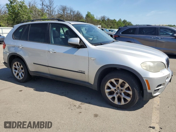 2012 BMW X5 35i with VIN 5UXZV4C5XCL749204, listed as a Copart auction lot 62012985 with 94,636 mi miles and Clean title. Bid and sale history available at DreamBid. Image 4.
