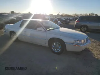 2002 Cadillac Eldorado z VIN 1G6EL12Y12B100821, wystawiony jako Copart lot #83495214 z przebiegiem 36 358 mil mil oraz Czysty tytuł • Clean title. Historia ofert i sprzedaży dostępna na DreamBid. Obrazek 4.