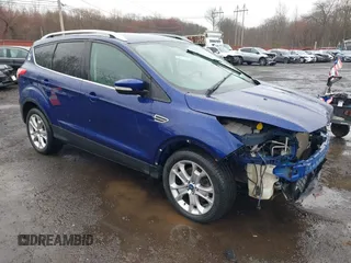 2014 Ford Escape Titanium with VIN 1FMCU9J99EUA46103, listed as a IAAI auction lot 42018097 with 169,878 mi miles and . Bid and sale history available at DreamBid. Image 1.