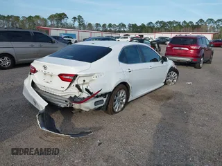 2019 Toyota Camry LE with VIN 4T1B11HK7KU806197, listed as a IAAI auction lot 41721148 with 83,373 mi miles and . Bid and sale history available at DreamBid. Image 4.