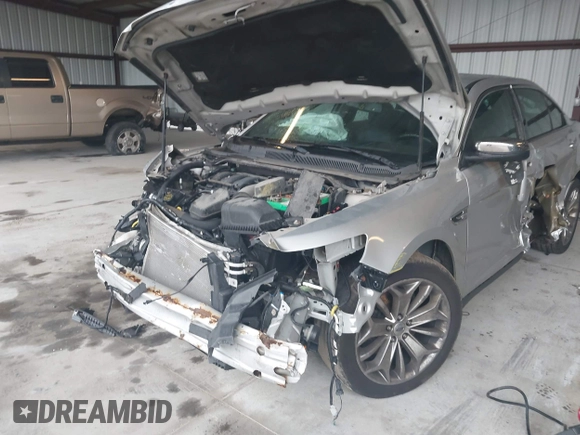 2014 Ford Taurus Limited с VIN 1FAHP2F89EG186147, выставлен на аукционе IAAI как лот 42228000 с пробегом 179 863 миль миль и . История ставок и продаж доступна на DreamBid. Изображение 6.