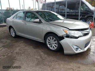 2014 Toyota Camry Hybrid LE with VIN 4T1BD1FK4EU106488, listed as a IAAI auction lot 40794286 with 98,911 mi miles. Bid and sale history available at carsss.com. Image 1.