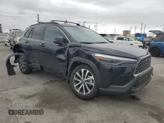 2024 Toyota Corolla Cross XLE with VIN 7MUDAAAG8RV095021, listed as a Copart auction lot 59232265 with 7,010 mi miles and Salvage title. Bid and sale history available at DreamBid. Image 4.
