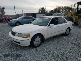 1996 Acura RL with VIN JH4KA9652TC000077, listed as a Copart auction lot 82430394 with 201,807 mi miles and Salvage Title. Bid and sale history available at carsss.com. Image 1.