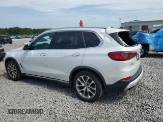 2019 BMW X5 xDrive40i with VIN 5UXCR6C5XKLK80703, listed as a Copart auction lot 63473495 with 57,260 mi miles and Salvage title. Bid and sale history available at DreamBid. Image 2.