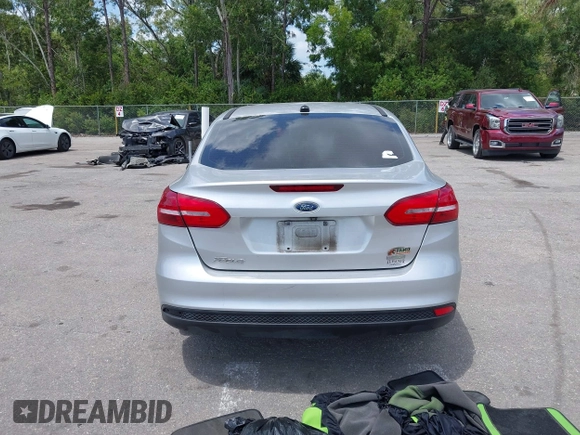 2018 Ford Focus SE z VIN 1FADP3FE9JL241661, wystawiony jako IAAI lot #42103513 z przebiegiem 117 003 mil mil oraz . Historia ofert i sprzedaży dostępna na DreamBid. Obrazek 16.