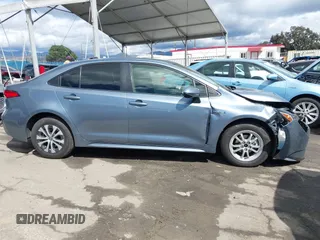 2021 Toyota Corolla Hybrid LE with VIN JTDEAMDE0MJ026601, listed as a IAAI auction lot 41797452 with 85,294 mi miles. Bid and sale history available at carsss.com. Image 13.