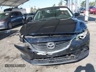 2015 Mazda 6 i Grand Touring with VIN JM1GJ1W61F1165006, listed as a IAAI auction lot 41988778 with 113,226 mi miles and . Bid and sale history available at carsss.com. Image 6.