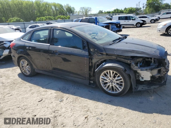 2017 Ford Focus Titanium with VIN 1FADP3J21HL260065, listed as a Copart auction lot 53165945 with 110,540 mi miles and Salvage title. Bid and sale history available at DreamBid. Image 4.