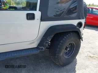 2003 Jeep Wrangler Sport z VIN 1J4FA49S73P302278, wystawiony jako IAAI lot #42219582 z przebiegiem 129 089 mil mil oraz . Historia ofert i sprzedaży dostępna na DreamBid. Obrazek 6.