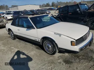 1987 Oldsmobile Toronado with VIN 1G3EZ1130HU307201, listed as a Copart auction lot 78028584 with 104,837 mi miles and Salvage Title. Bid and sale history available at DreamBid. Image 4.