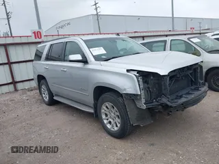 2015 GMC Yukon SLT z VIN 1GKS1BKC0FR172661, wystawiony jako IAAI lot #41911331 z przebiegiem 171 815 mil mil oraz . Historia ofert i sprzedaży dostępna na DreamBid. Obrazek 1.