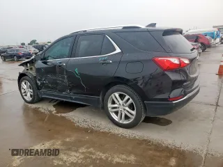 2021 Chevrolet Equinox Premier z VIN 2GNAXNEV9M6136701, wystawiony jako Copart lot #57288215 z przebiegiem 62 808 mil mil oraz Szkoda całkowita • Salvage title. Historia ofert i sprzedaży dostępna na DreamBid. Obrazek 2.