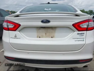 2016 Ford Fusion Titanium Hybrid with VIN 3FA6P0RU3GR190355, listed as a IAAI auction lot 42384309 with 157,172 mi miles and . Bid and sale history available at DreamBid. Image 16.