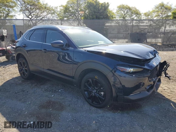 2023 Mazda CX-30 S Premium with VIN 3MVDMBDM7PM543849, listed as a Copart auction lot 54852415 with 20,898 mi miles and Salvage title. Bid and sale history available at DreamBid. Image 4.