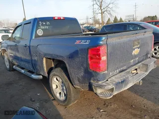 2017 Chevrolet Silverado 1500 LT with VIN 1GCVKREC7HZ349638, listed as a IAAI auction lot 41797563 with 136,915 mi miles. Bid and sale history available at carsss.com. Image 3.