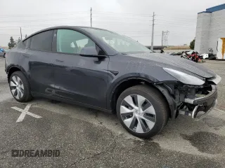 2024 Tesla Model Y with VIN 7SAYGDED5RF093410, listed as a Copart auction lot 50557225 with 6,396 mi miles and Salvage Title. Bid and sale history available at DreamBid. Image 4.