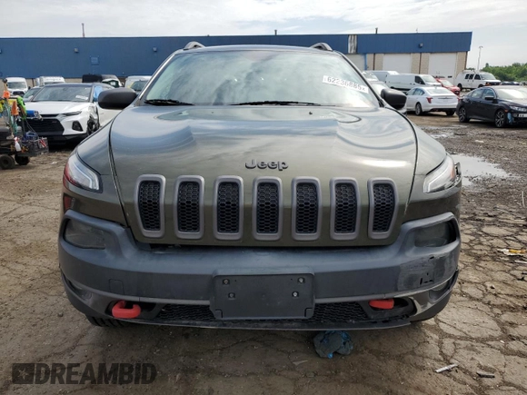 2015 Jeep Cherokee Trailhawk with VIN 1C4PJMBSXFW545534, listed as a Copart auction lot 62236885 with 148,448 mi miles and Clean title. Bid and sale history available at DreamBid. Image 5.