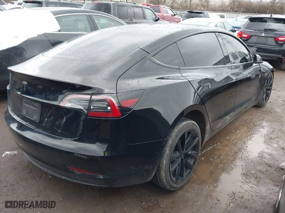2023 Tesla Model 3 with VIN 5YJ3E1EA1PF512562, listed as a IAAI auction lot 41719618 with 43,612 mi miles. Bid and sale history available at carsss.com. Image 4.