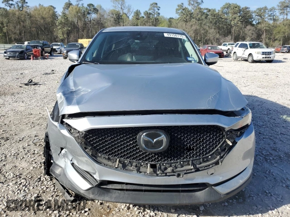 2021 Mazda CX-5 Grand Touring with VIN JM3KFADM8M1339008, listed as a Copart auction lot 49150115 with 144,851 mi miles and Salvage Title. Bid and sale history available at carsss.com. Image 5.