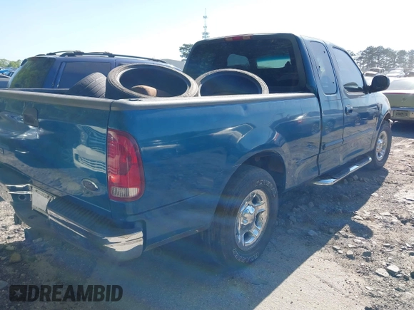 2000 Ford F-150 XL with VIN 1FTRX17L5YNC02971, listed as a IAAI auction lot 42041309 with Not provided miles and . Bid and sale history available at DreamBid. Image 4.