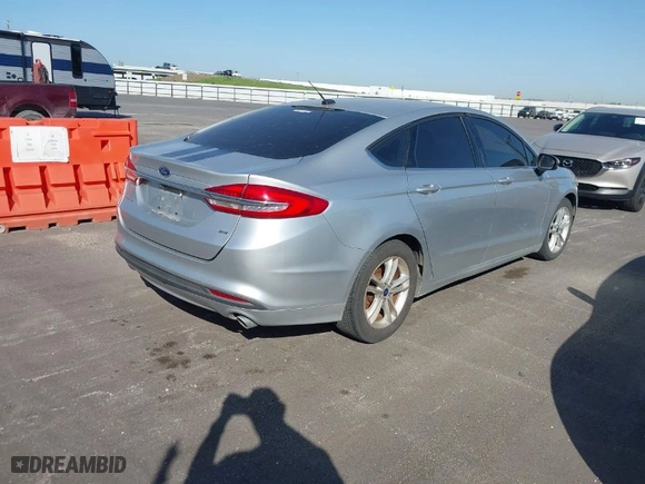 2018 Ford Fusion SE with VIN 3FA6P0H72JR117545, listed as a IAAI auction lot 42012543 with 147,214 mi miles. Bid and sale history available at carsss.com. Image 4.