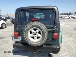 2000 Jeep Wrangler Sahara z VIN 1J4FA59S1YP746043, wystawiony jako Copart lot #58842665 z przebiegiem 148 348 mil mil oraz Szkoda całkowita • Salvage title. Historia ofert i sprzedaży dostępna na DreamBid. Obrazek 6.