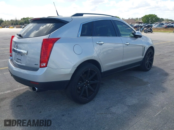 2013 Cadillac SRX z VIN 3GYFNAE32DS512534, wystawiony jako IAAI lot #41596602 z przebiegiem 193 131 mil mil oraz . Historia ofert i sprzedaży dostępna na DreamBid. Obrazek 4.