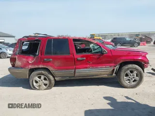2004 Jeep Grand Cherokee Laredo z VIN 1J4GW48S34C289321, wystawiony jako IAAI lot #42062819 z przebiegiem Nie podano mil oraz . Historia ofert i sprzedaży dostępna na DreamBid. Obrazek 13.
