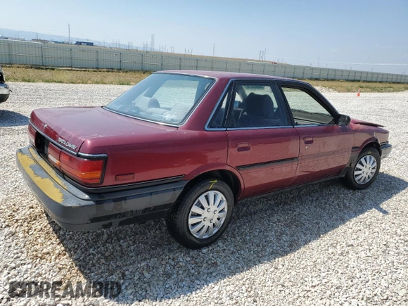 1991 Toyota Camry DLX z VIN 4T1SV21E4MU332100, wystawiony jako Copart lot #64645474 z przebiegiem 164 143 mil mil oraz Czysty tytuł • Clean title. Historia ofert i sprzedaży dostępna na DreamBid. Obrazek 3.