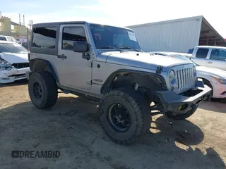 2014 Jeep Wrangler Sport with VIN 1C4AJWAG5EL206565, listed as a IAAI auction lot 42015000 with 90,129 mi miles and . Bid and sale history available at carsss.com. Image 1.