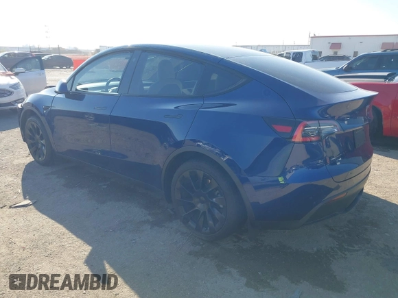 2021 Tesla Model Y Standard Range with VIN 5YJYGDED5MF121874, listed as a IAAI auction lot 41238170 with 72,041 mi miles and . Bid and sale history available at DreamBid. Image 3.
